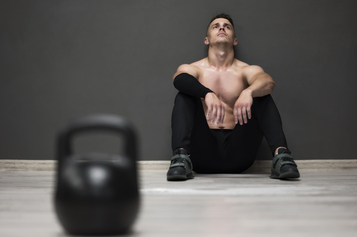 low-angle-man-tired-from-workout